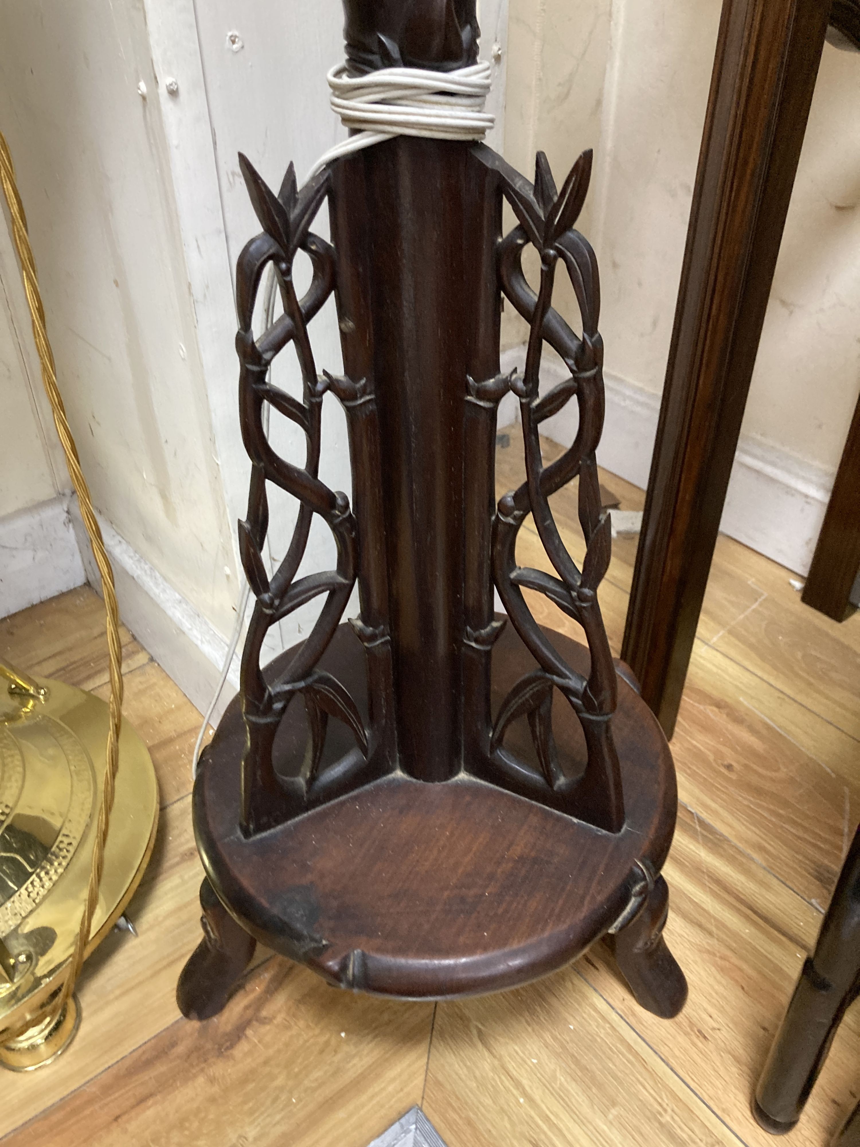 A Chinese carved hardwood floor lamp. H-167cm.